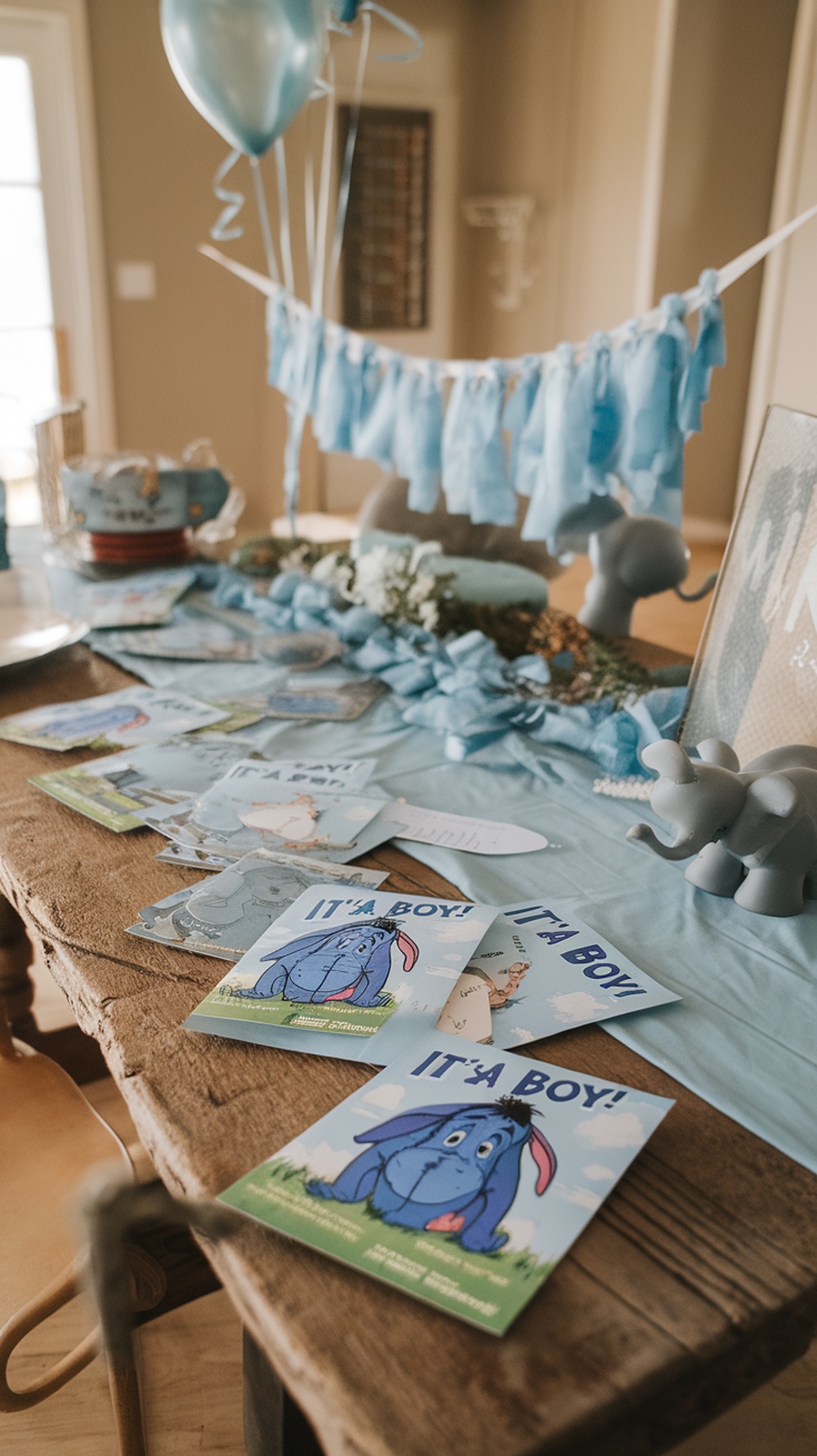 Eeyore-themed baby shower invitations on a table