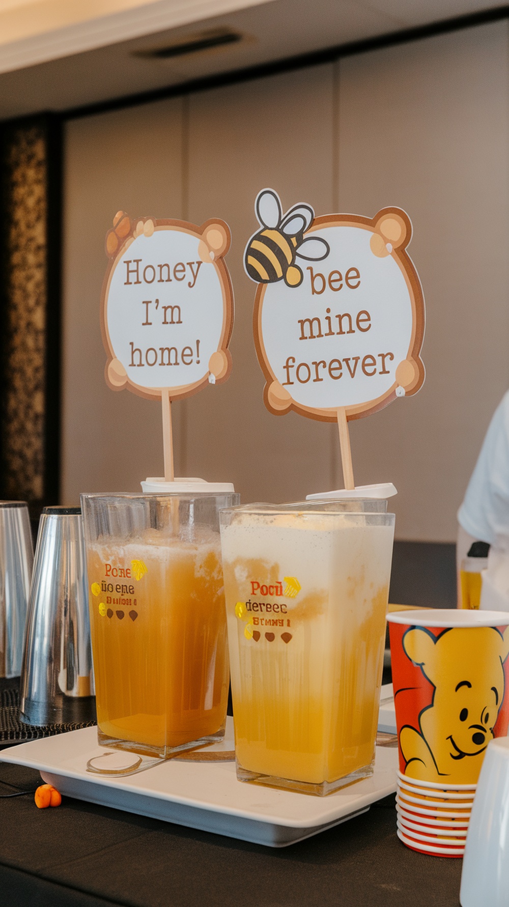Honey flavored beverage station with drinks and playful signs